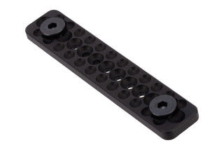 Short aluminum M-LOK rail cover with dimpled texture, black.